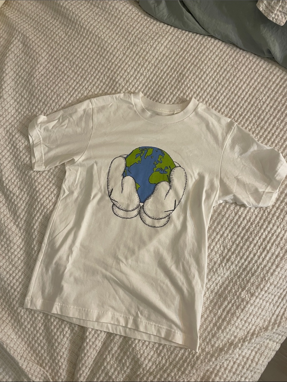 Men’s KAWS Graphic Tee with Globe and Hands